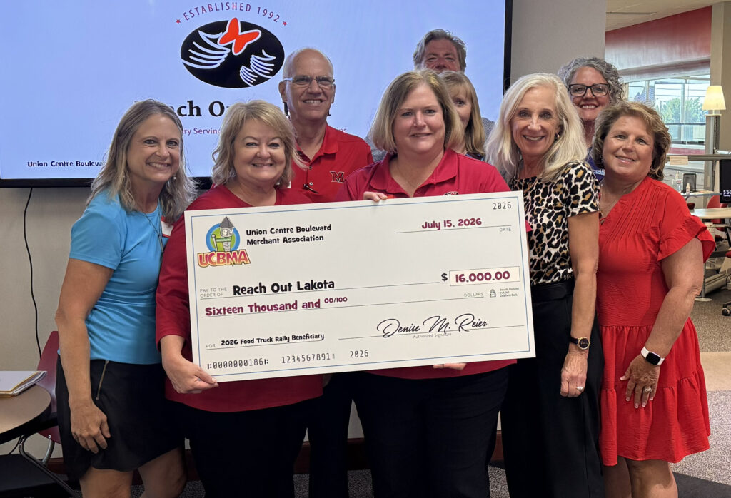 UCBMA presenting a check to Reach Out Lakota