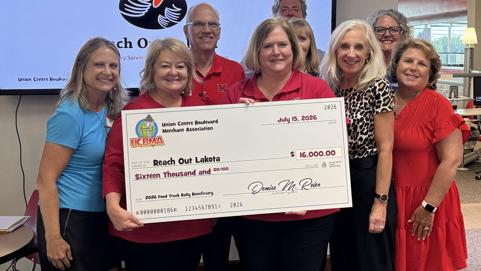 UCBMA presenting a check to Reach Out Lakota